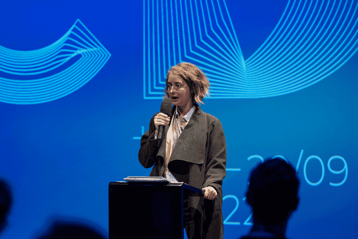 Lady presenting data.